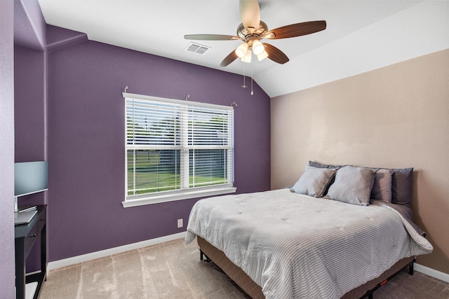 carpeted bedroom featuring visible vents, baseboards, a ceiling fan, and lofted ceiling