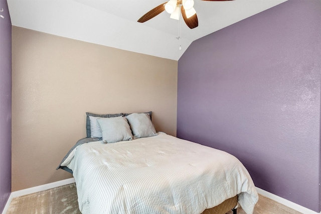 carpeted bedroom featuring baseboards, a ceiling fan, and vaulted ceiling