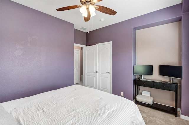bedroom with ceiling fan, carpet, and visible vents