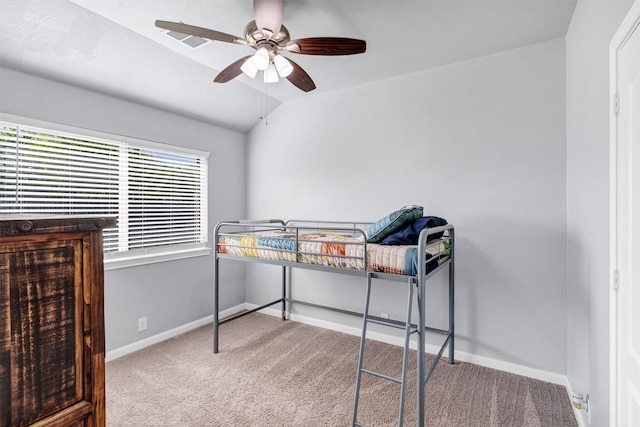 carpeted bedroom with baseboards and ceiling fan