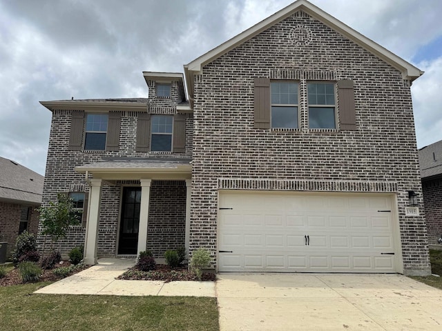 traditional-style home with brick siding, concrete driveway, and an attached garage