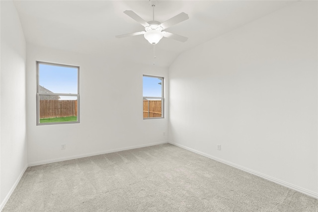 1905 Bobbin Ml, Forney, TX 75126 - empty room with light colored carpet, healthy amount of natural light, baseboards, a ceiling fan, and vaulted ceiling