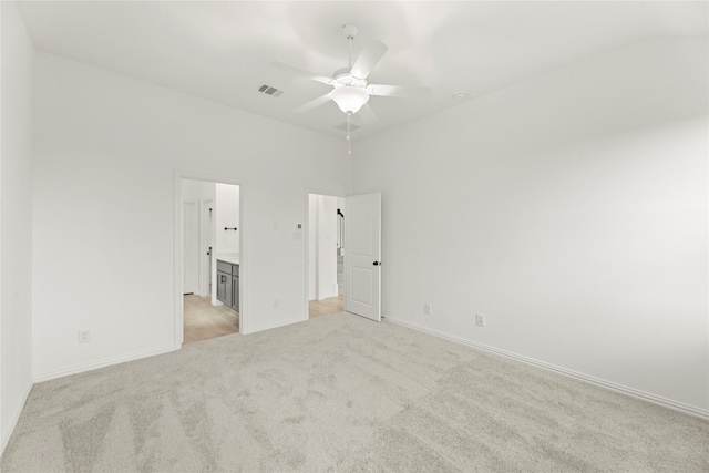 1905 Bobbin Ml, Forney, TX 75126 - unfurnished bedroom featuring light colored carpet, baseboards, connected bathroom, and a ceiling fan