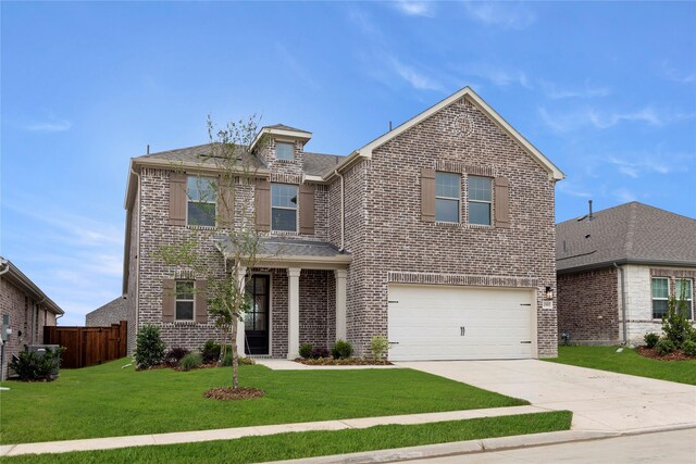 1905 Bobbin Ml, Forney, TX 75126 - traditional-style home with brick siding, concrete driveway, and an attached garage