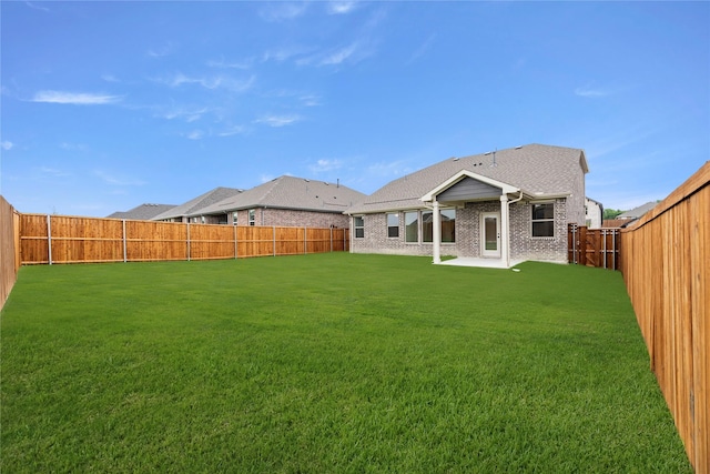 1905 Bobbin Ml, Forney, TX 75126 - rear view of house with brick siding and a patio area