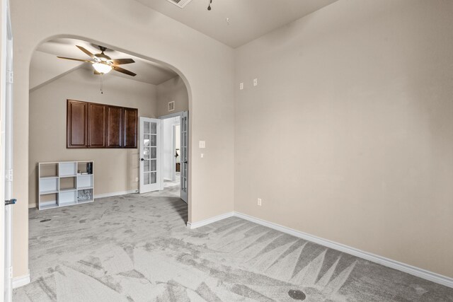 1321 Spanish Needle Trl, Fort Worth, TX 76177 - unfurnished room featuring ceiling fan, arched walkways, light colored carpet, visible vents, and baseboards