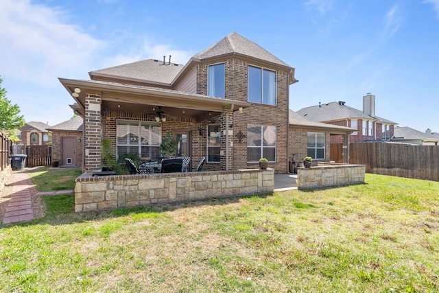 1321 Spanish Needle Trl, Fort Worth, TX 76177 - back of property with a patio area, a yard, ceiling fan, a fenced backyard, and brick siding