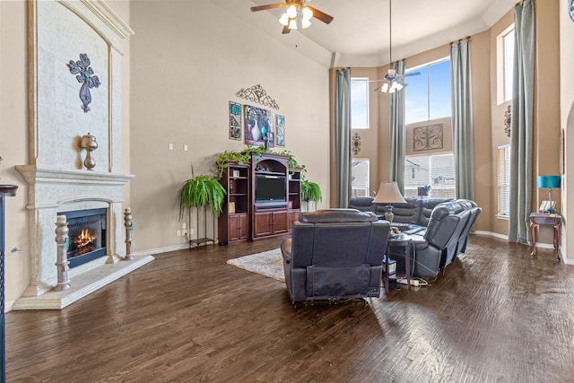 1321 Spanish Needle Trl, Fort Worth, TX 76177 - living room with baseboards, a high ceiling, ceiling fan, a fireplace, and wood finished floors