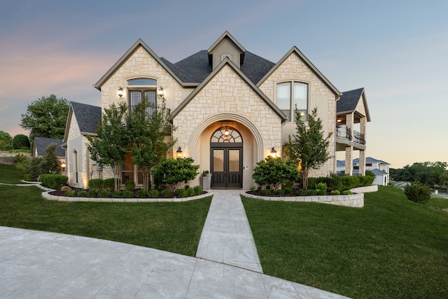 2413 Versailles Dr, Heath, TX 75032 - french country style house featuring french doors, a balcony, and stone siding