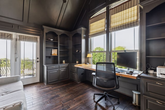 2413 Versailles Dr, Heath, TX 75032 - home office with healthy amount of natural light, built in study area, lofted ceiling, and dark wood-style flooring