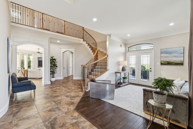 2413 Versailles Dr, Heath, TX 75032 - foyer entrance featuring stairway, arched walkways, ornamental molding, recessed lighting, and baseboards