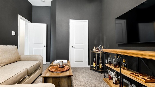 living room with baseboards and carpet