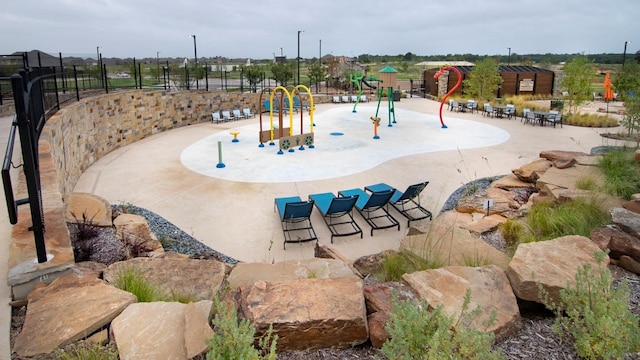view of play area featuring fence