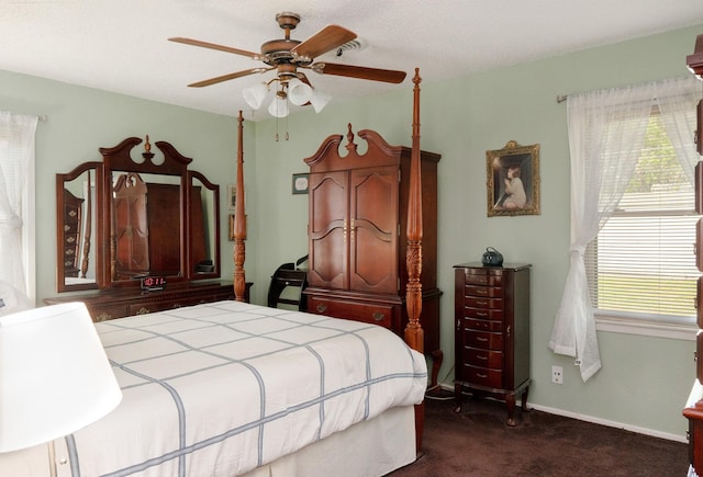 bedroom with dark carpet and ceiling fan