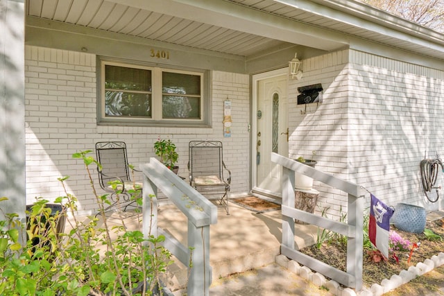 property entrance with brick siding
