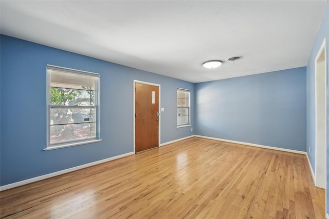 interior space featuring wood finished floors and baseboards