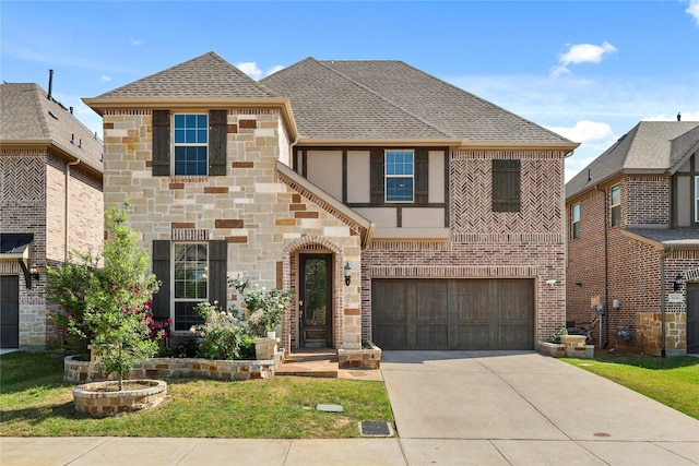 3432 Poinsettia Way, Irving, TX 75038 - view of front of property featuring a garage, driveway, brick siding, roof with shingles, and a front yard