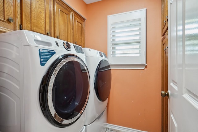 2833 S Country Club Rd, Garland, TX 75043 - laundry room with washing machine and clothes dryer and cabinet space