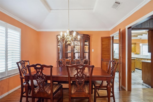 2833 S Country Club Rd, Garland, TX 75043 - dining room with visible vents, baseboards, ornamental molding, a chandelier, and wood finished floors