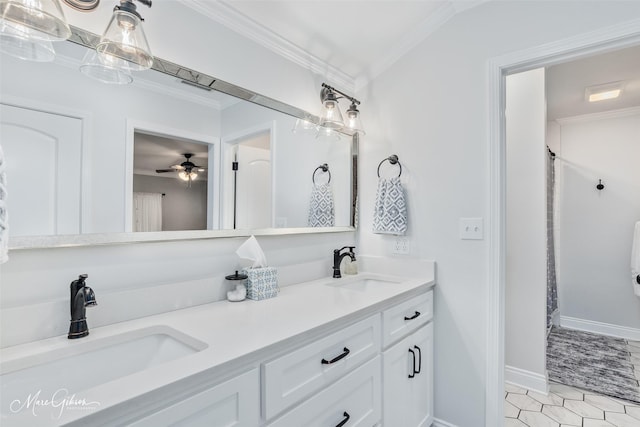 bathroom with double vanity, a sink, and ornamental molding