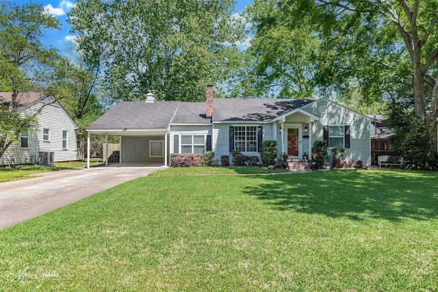 view of front facade featuring a carport, driveway, a chimney, and a front lawn