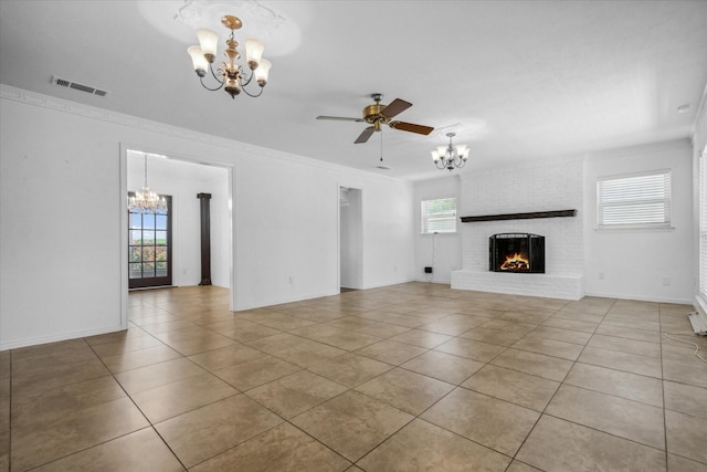 unfurnished living room featuring tile patterned flooring, visible vents, crown molding, and a brick fireplace