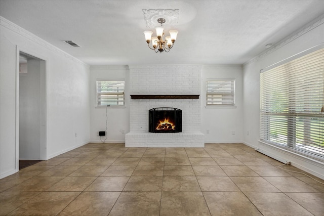 unfurnished living room featuring visible vents, baseboards, an inviting chandelier, a fireplace, and tile patterned floors