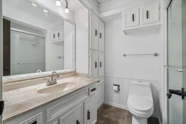 full bathroom with a shower with door, vanity, crown molding, toilet, and stone finish floor