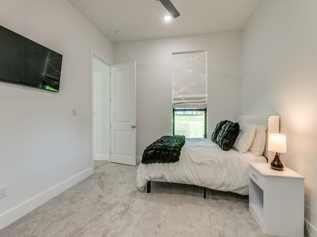 bedroom featuring carpet and baseboards