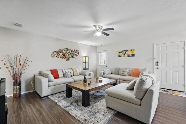 5540 Mcclelland St, Forney, TX 75126 - living area featuring ceiling fan, dark wood finished floors, and baseboards