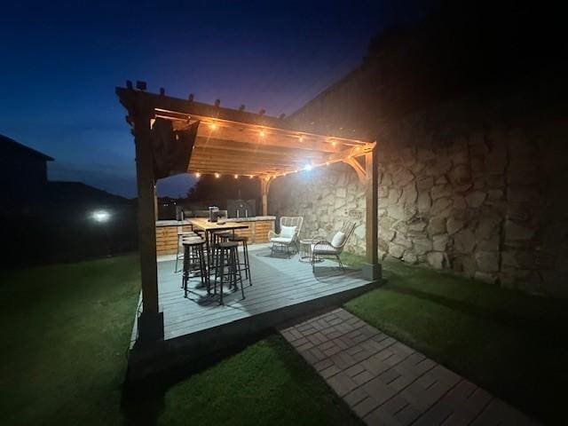 5540 Mcclelland St, Forney, TX 75126 - patio at twilight featuring a pergola and a wooden deck