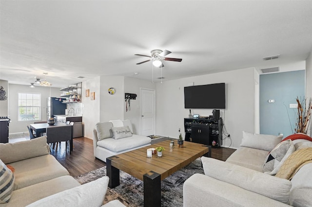 5540 Mcclelland St, Forney, TX 75126 - living area with a ceiling fan, wood finished floors, and a chandelier
