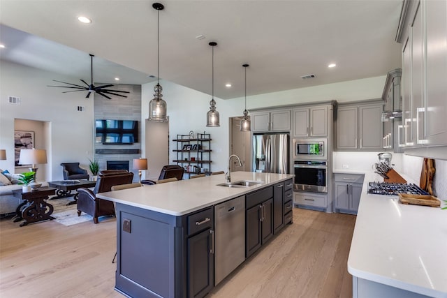 2313 Sandlin Dr, Fort Worth, TX 76008 - kitchen featuring light wood-style flooring, light countertops, visible vents, appliances with stainless steel finishes, and a sink