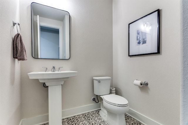 2313 Sandlin Dr, Fort Worth, TX 76008 - half bath featuring tile patterned floors, baseboards, and toilet