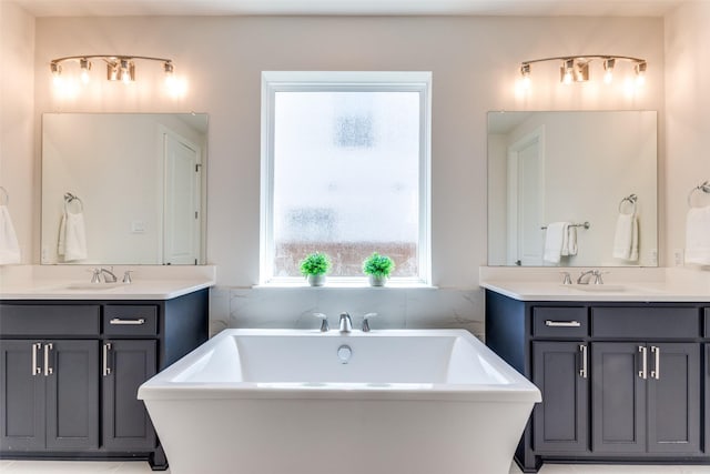 2313 Sandlin Dr, Fort Worth, TX 76008 - full bathroom with two vanities, a sink, and a freestanding tub