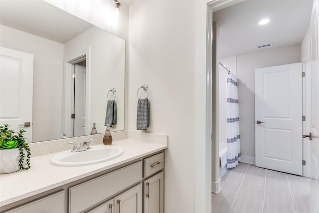 2313 Sandlin Dr, Fort Worth, TX 76008 - full bath featuring visible vents, baseboards, shower / bath combination with curtain, vanity, and tile patterned floors