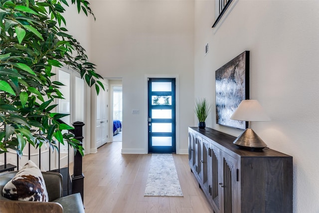 2313 Sandlin Dr, Fort Worth, TX 76008 - entryway with visible vents, baseboards, light wood-type flooring, and a towering ceiling
