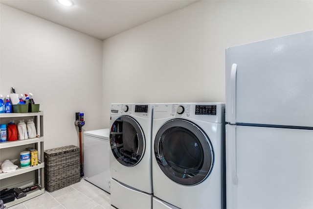 2313 Sandlin Dr, Fort Worth, TX 76008 - laundry area with separate washer and dryer, laundry area, and light tile patterned flooring
