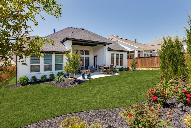 2313 Sandlin Dr, Fort Worth, TX 76008 - rear view of house featuring a lawn, a patio, fence private yard, and a shingled roof
