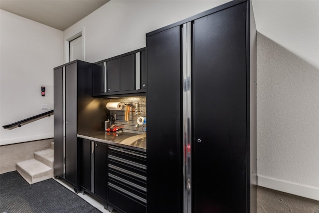 2313 Sandlin Dr, Fort Worth, TX 76008 - bar with black fridge, bar area, backsplash, and stairway