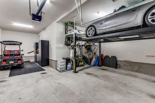 2313 Sandlin Dr, Fort Worth, TX 76008 - garage featuring a garage door opener