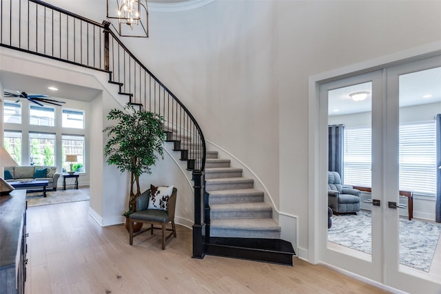 2313 Sandlin Dr, Fort Worth, TX 76008 - stairs featuring a high ceiling, wood finished floors, and a healthy amount of sunlight