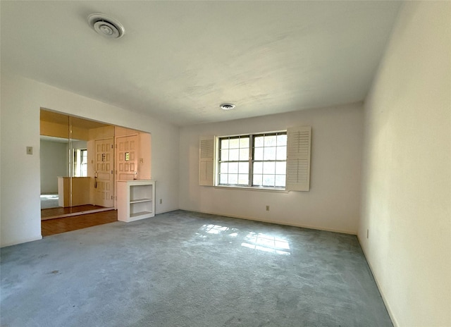 10016 Clearmeadow Dr, Dallas, TX 75238 - unfurnished bedroom featuring carpet and visible vents