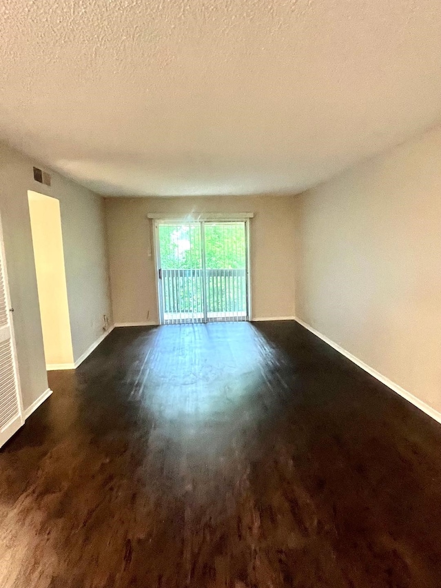 4851 Cedar Springs Rd Unit 391, Dallas, TX 75219 - empty room featuring visible vents, baseboards, and a textured ceiling
