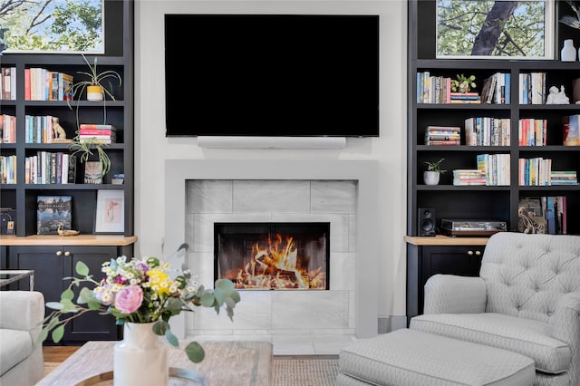 sitting room with a tiled fireplace