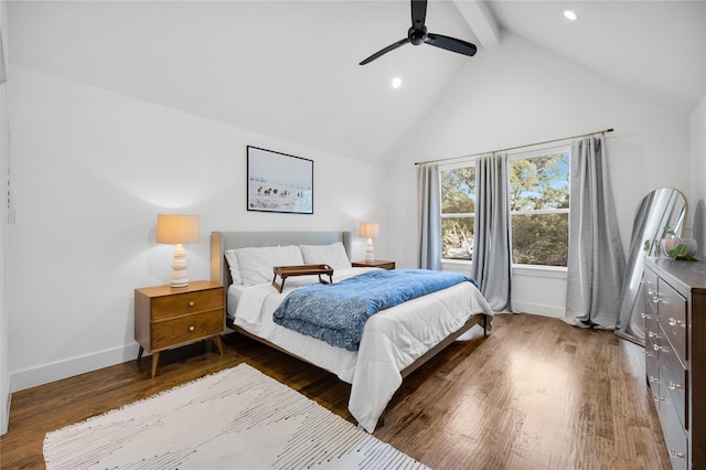 bedroom featuring high vaulted ceiling, baseboards, beam ceiling, and wood finished floors