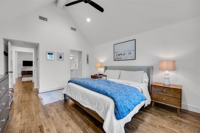 bedroom featuring high vaulted ceiling, beamed ceiling, visible vents, wood finished floors, and baseboards