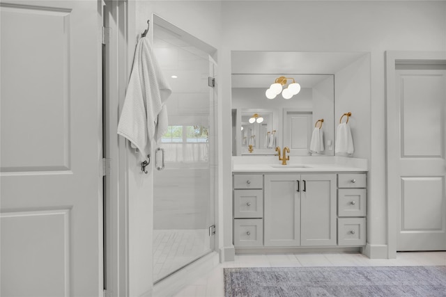 full bath with tile patterned flooring, vanity, and a stall shower