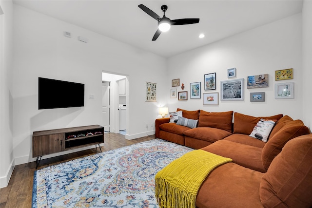 living room with wood finished floors, baseboards, a ceiling fan, and recessed lighting