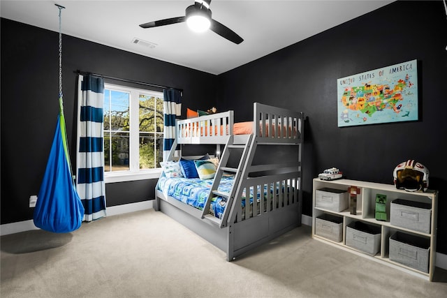 bedroom with a ceiling fan, baseboards, carpet, and visible vents